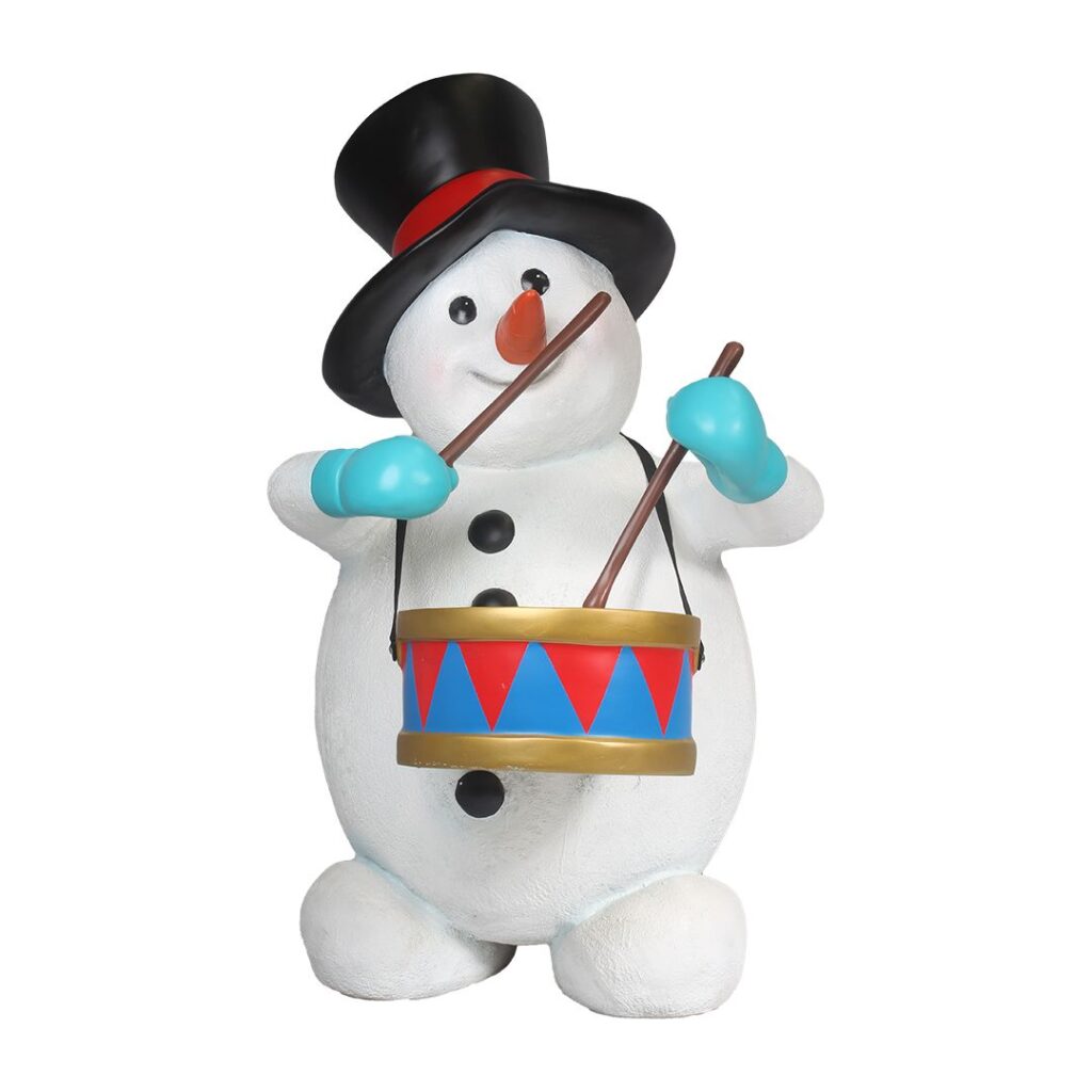 A figure of a snowman playing a drum.