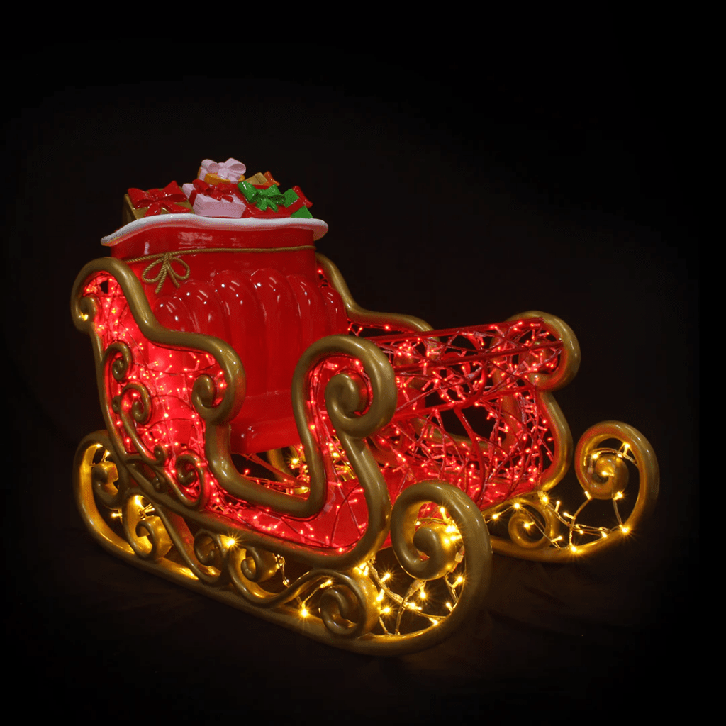 A large red and gold sleigh made of lights.