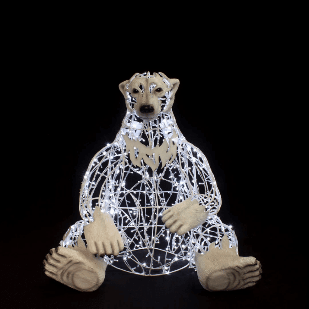 A large sitting polar bear made of white lights.