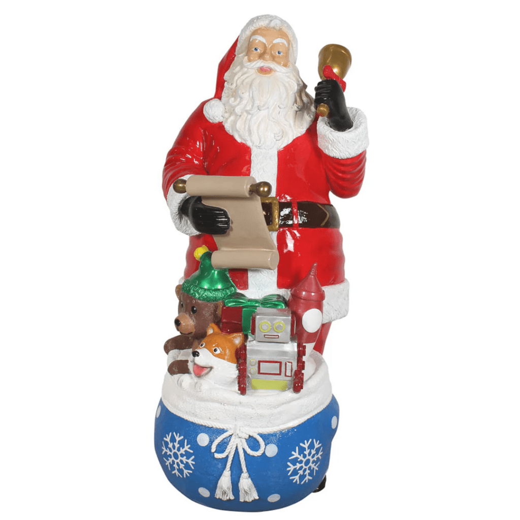 A Santa Claus figure with a bell and a blue bag of toys.