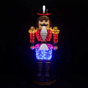A large nutcracker made of red, blue, and yellow lights.