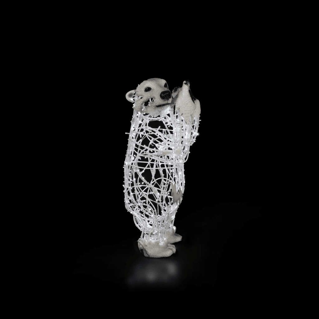 A standing baby polar bear made of white lights.