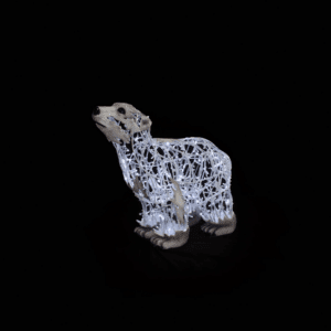 A standing baby polar bear made of white lights.