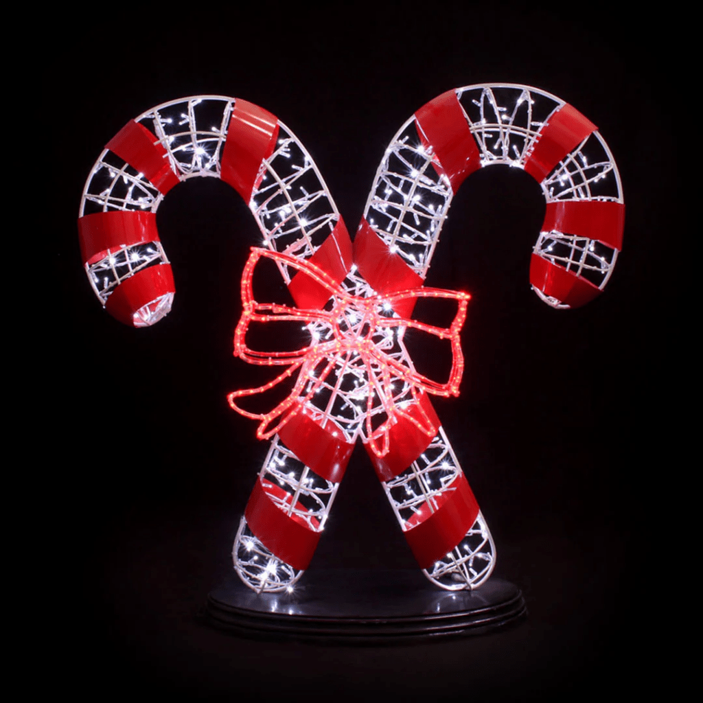 Two crossing candy canes made of lights, with a red bow in the middle.