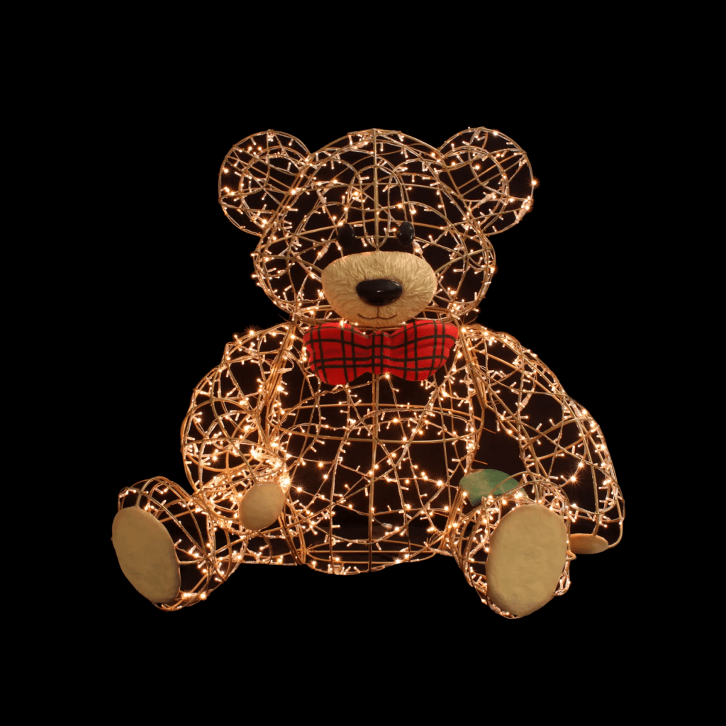 A large teddy bear made of white lights, with a red and green bowtie.