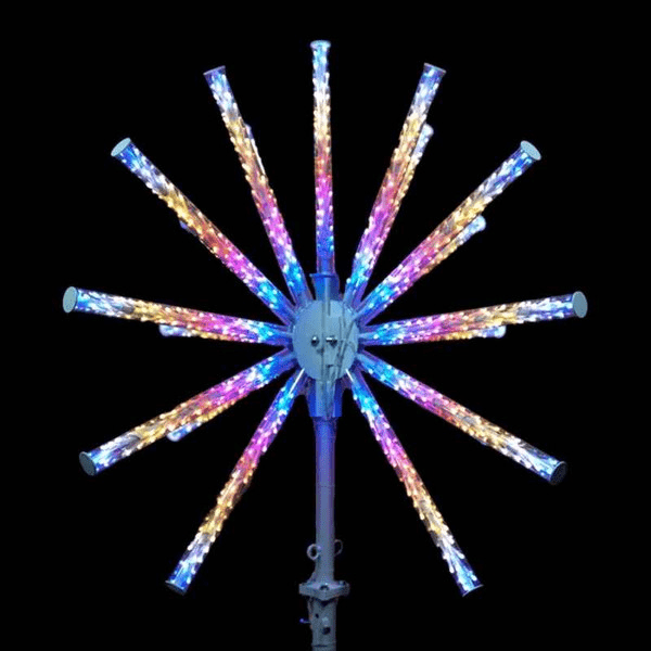 A large "burst" styled tree topper made of multi colored lights.