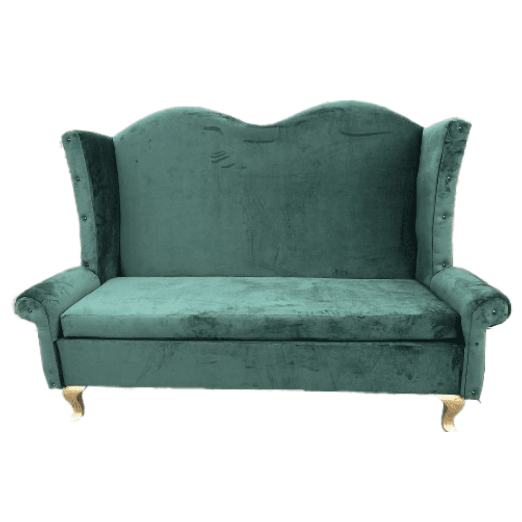 A large green velvet sofa with gold legs.