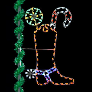 A Christmas light silhouette of a brown cowboy boot filled with Christmas candy.