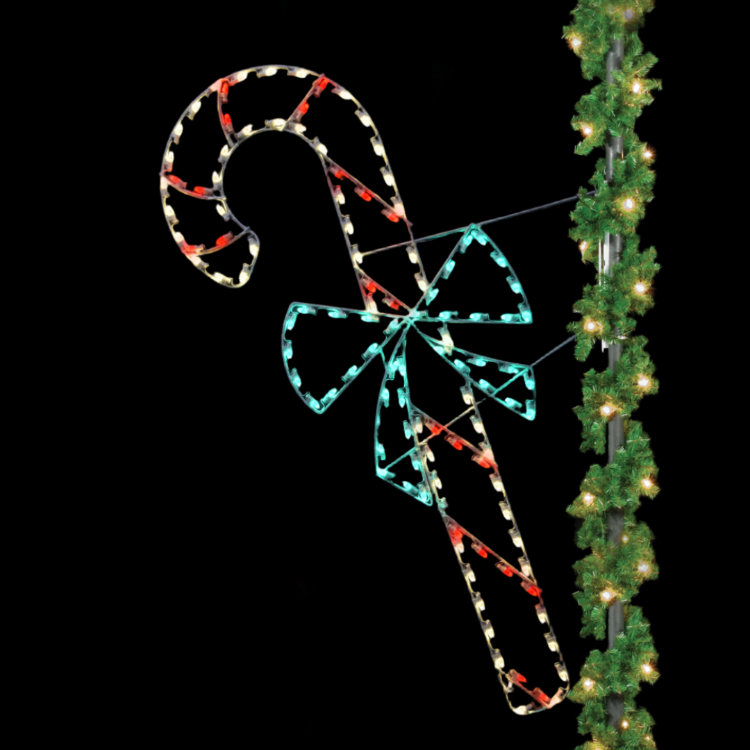 A large Christmas light silhouette of a candy cane with a green bow,