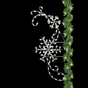 A Christmas light silhouette of two white snowflakes and whimsical curves.