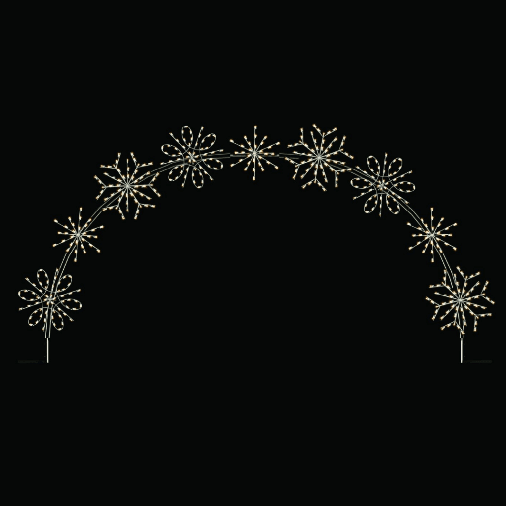 A lighted Christmas silhouette of an arch made of snowflakes.
