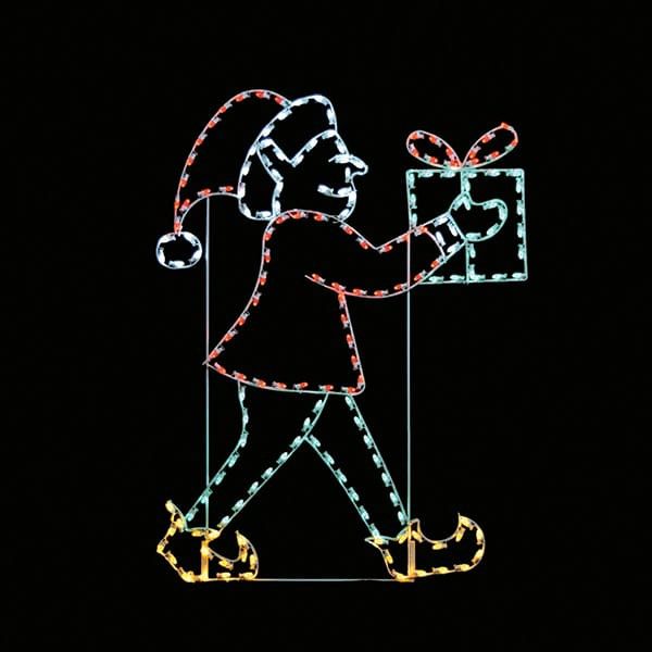 A lighted Christmas silhouette of an elf walking with a green present with a red bow.