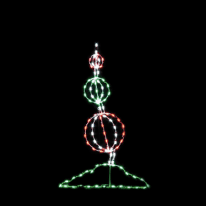 A lighted Christmas silhouette of a tree made of three candy gum drops.