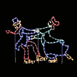 A lighted Christmas silhouette of two skaters dancing.