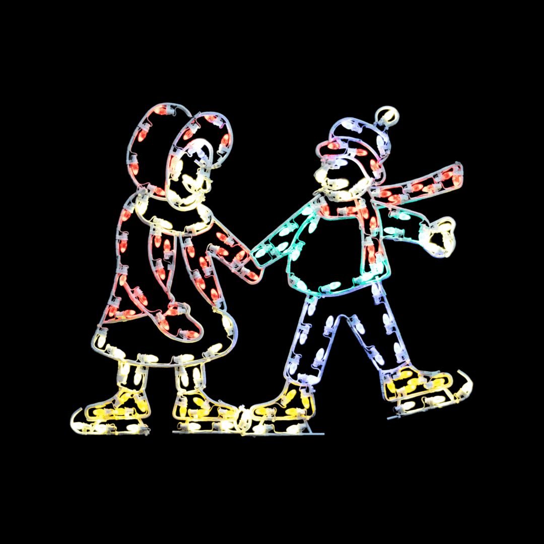 A lighted Christmas silhouette of a boy and girl holding hands and skating.