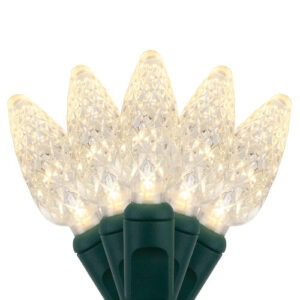 A fan of five (5) warm white C6 style LED lights on a green base and wire.