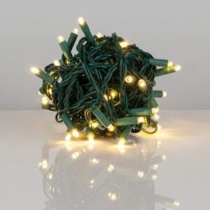 Warm white LED lights with green wire, lighted and wrapped into a ball.