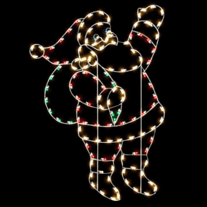 A lighted Christmas silhouette of Santa Claus waving, holding a green bag of presents.