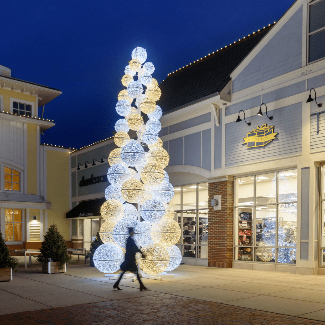 Multiple pure white and warm white LED orbs, stacked on top of each other in the shape of a tree.