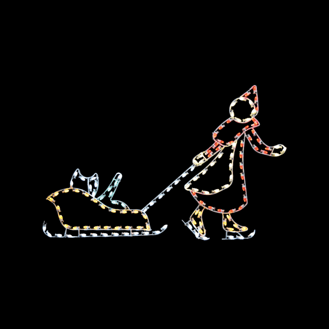 A lighted Christmas silhouette of a girl in a long red jacket skating, and pulling a sled caring a baby.