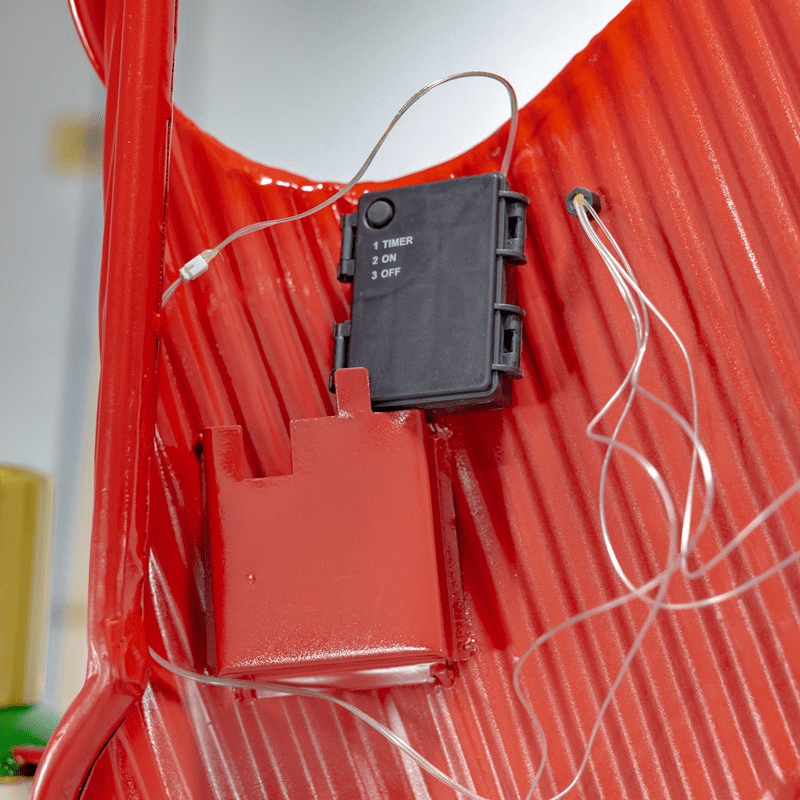 The back of the archway showing a battery pack used to light the mini LED lights on the top signage.