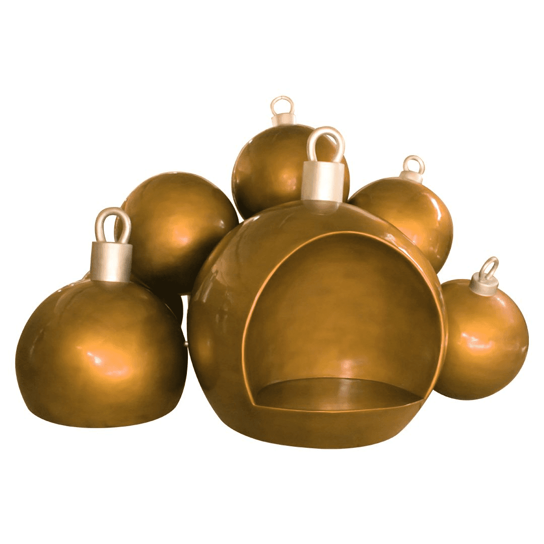 An image of a cluster of gold Christmas ornaments. The front ornament is hollowed out and has a seat inside.