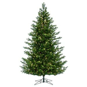 A green artificial Christmas tree pre-lit with warm white mini LED Christmas lights.