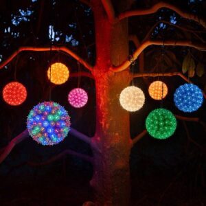 A tree with multicolored illuminated spheres hanging from the branches.