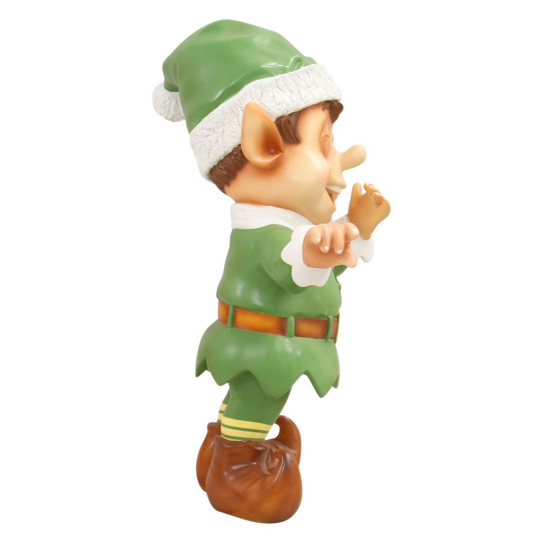 A fiberglass figure of a Christmas elf laughing.