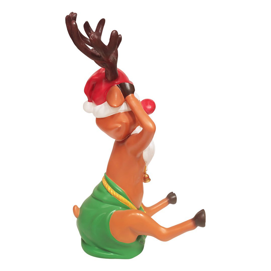 A cartoonish-looking Christmas reindeer with a red nose, wearing a Santa hat and fake white beard.