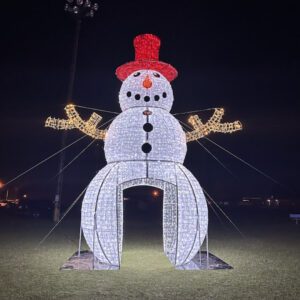 A large 3D snowman made from lights with a walkthrough arch in the middle.