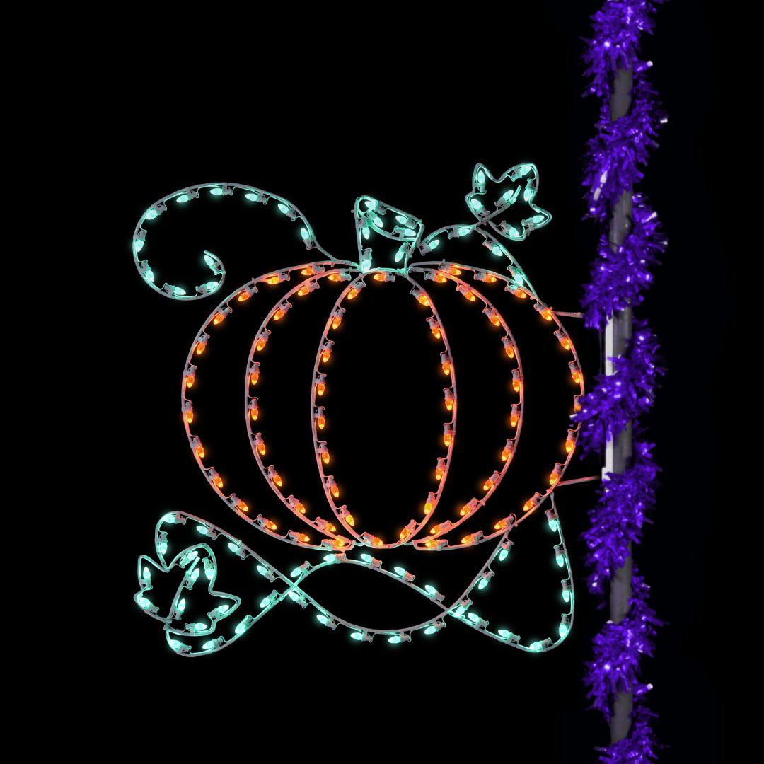 A Christmas light silhouette of a pumpkin with green vines, mounted to the side of a light pole wrapped with purple garland.