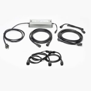 A silver power supply brick and multiple black coaxial cables.