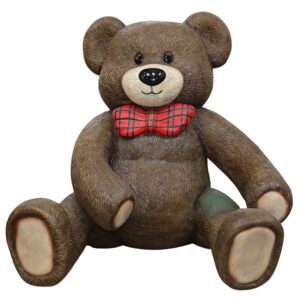 A large brown teddy bear with a red bowtie, sitting down.