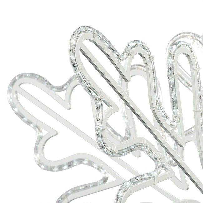 A 3D snowflake made from pure white rope light.