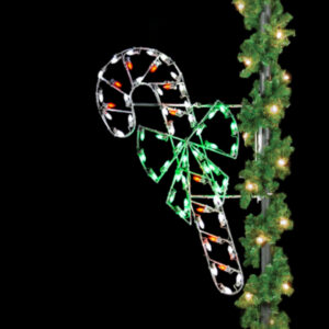 A small Christmas light silhouette of a red and white striped candy cane with a green bow.