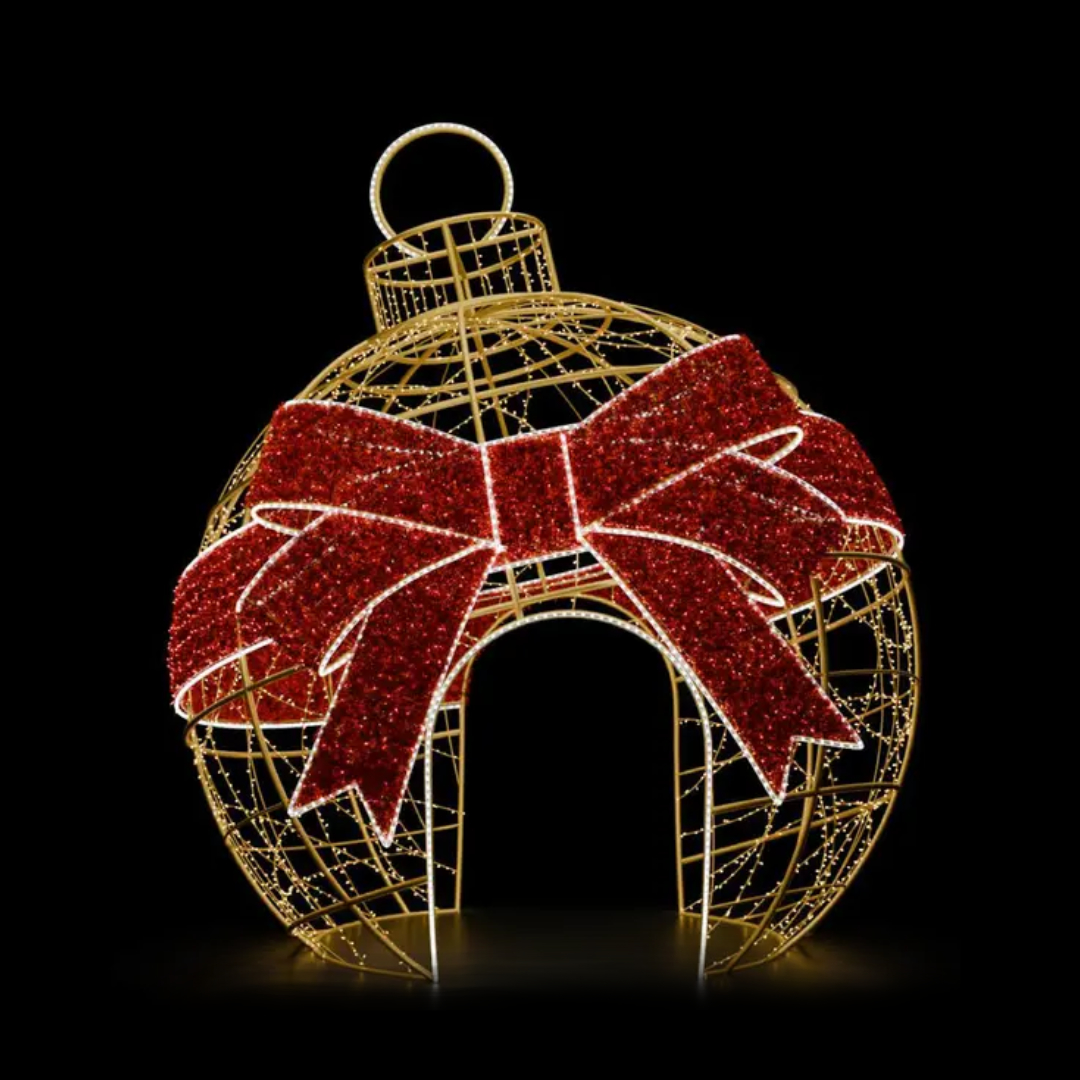 A large walk through ornament made of mini LED Christmas lights, with a big red carpet garland bow.