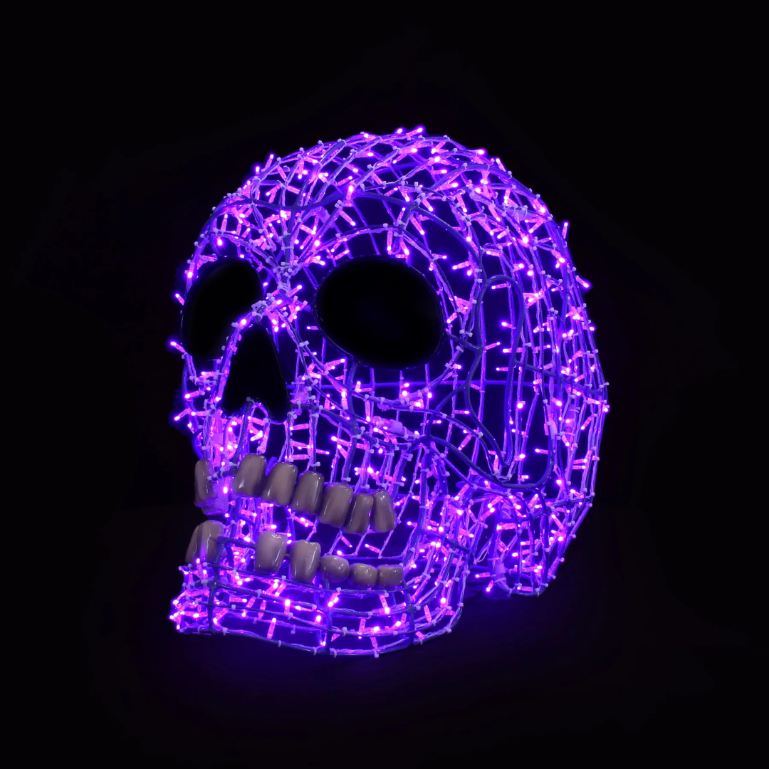 A Christmas light display of a 3D smiling human skull made from purple mini LED Christmas lights.